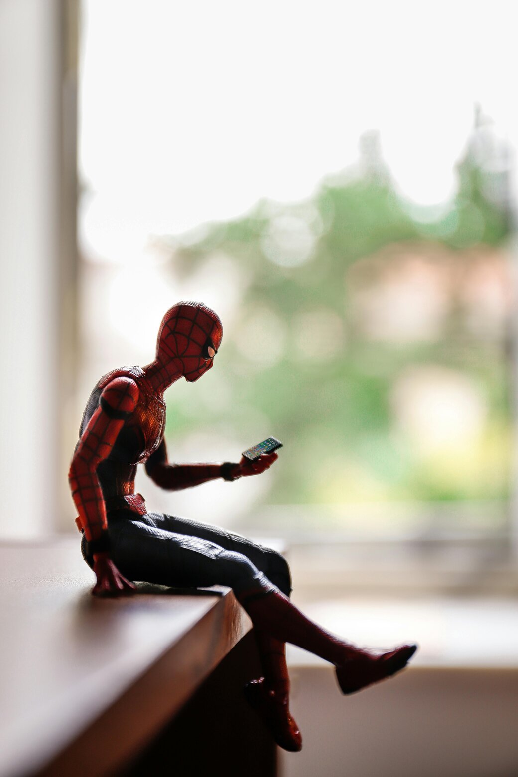 Spiderman on his phone